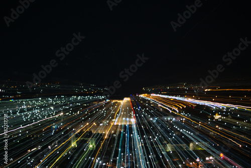 light lines with long exposure,  speed motion abstract background in the dark night ,  blast zoom effect , zoom burst of light in the city © kae2nata