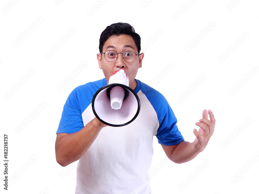 Young Man Shouting with Megaphone, Promotion Concept Young Man Shouting with Megaphone, Promotion Concept