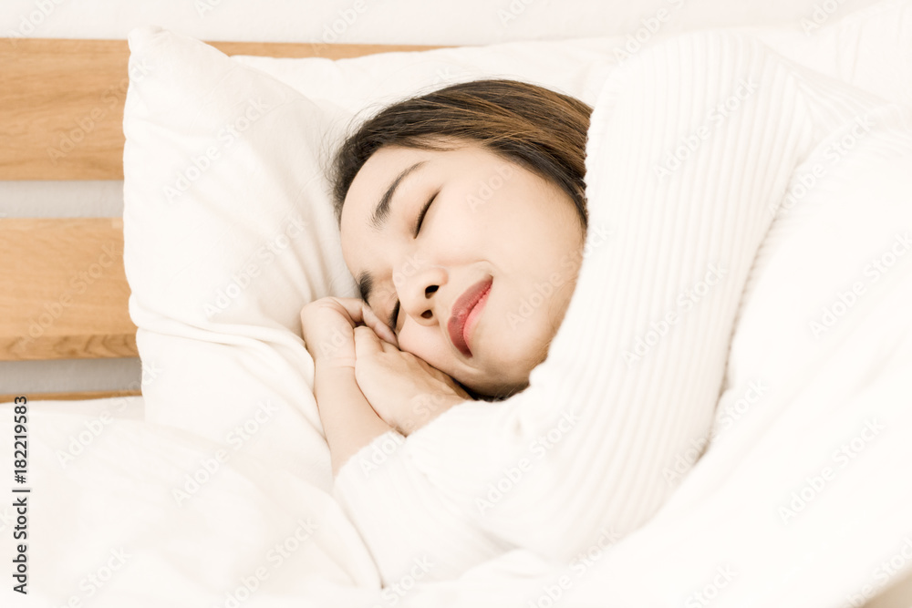 women sleep on bed in bedroom
