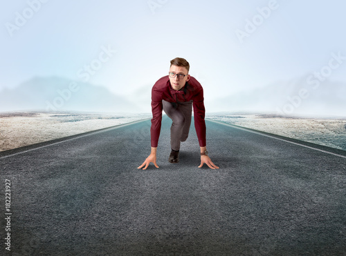 Businessman kneeling in ready position