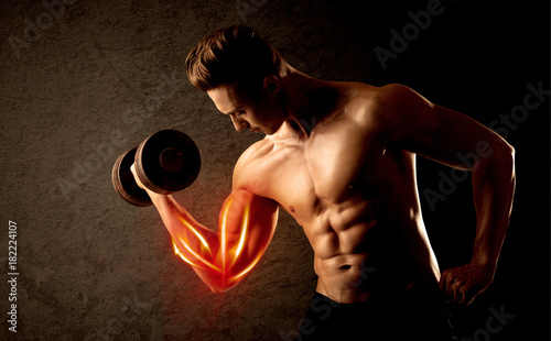 Fit bodybuilder lifting weight with red muscle concept