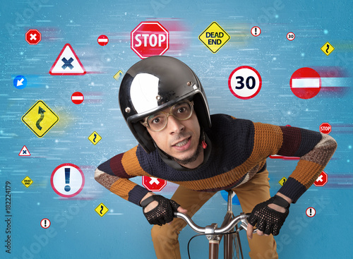 Fotografi Stylish biker with highway code concept