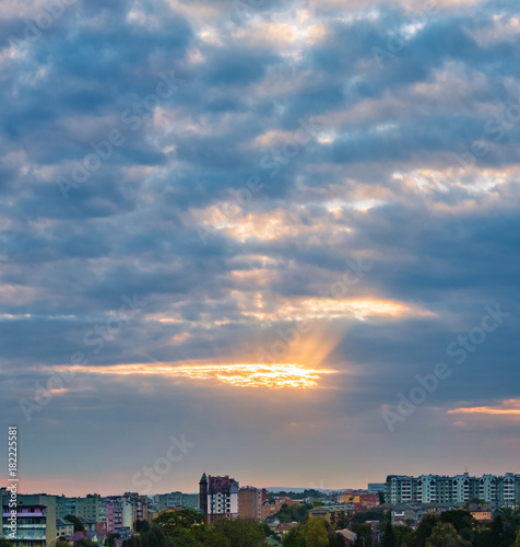 Wallpaper Mural the sun's rays make their way through the dark dramatic clouds over the city of Ivano-Frankivsk, Ukraine Torontodigital.ca