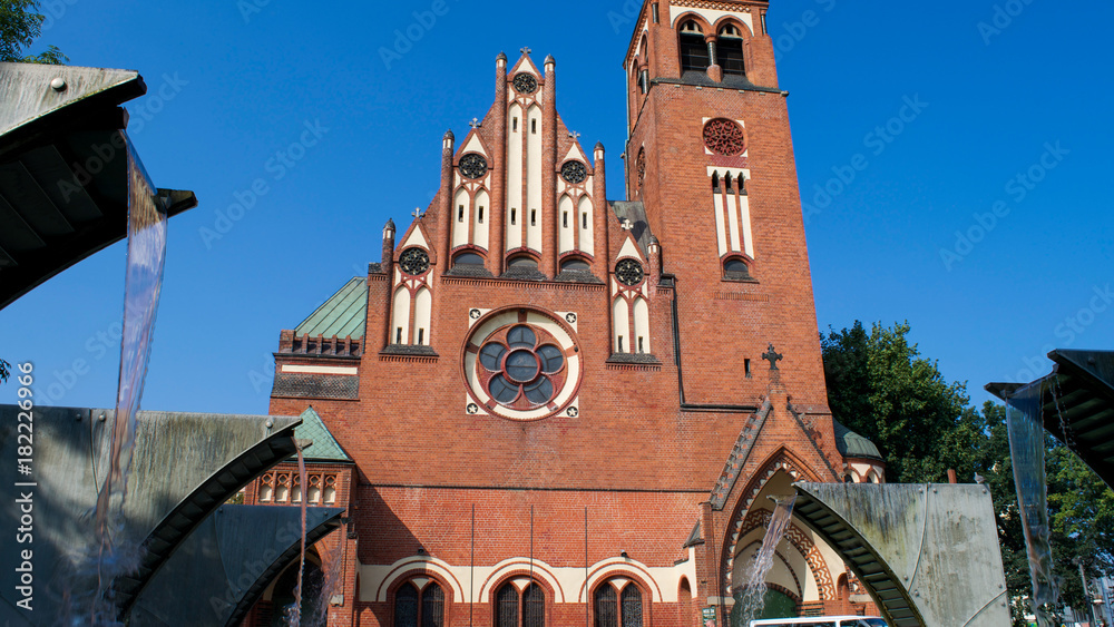 Obraz premium Water fountains in front of the Garrison Church of St. Adalbert in Szczecin, Poland