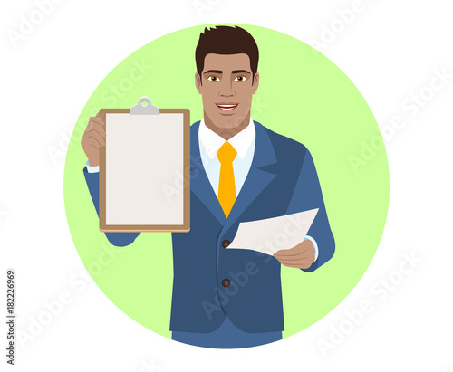 Businessman with paper holding the clipboard