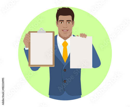 Businessman holding the clipboard and paper