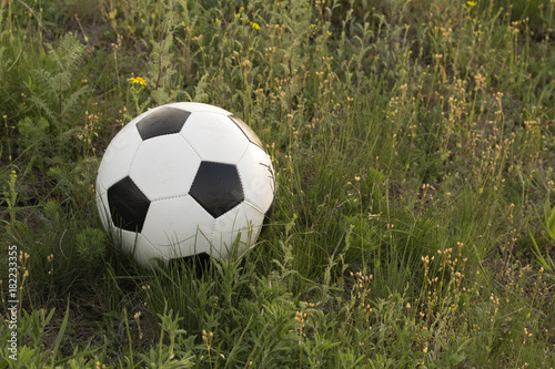 Football and the green hill. © indigolotos