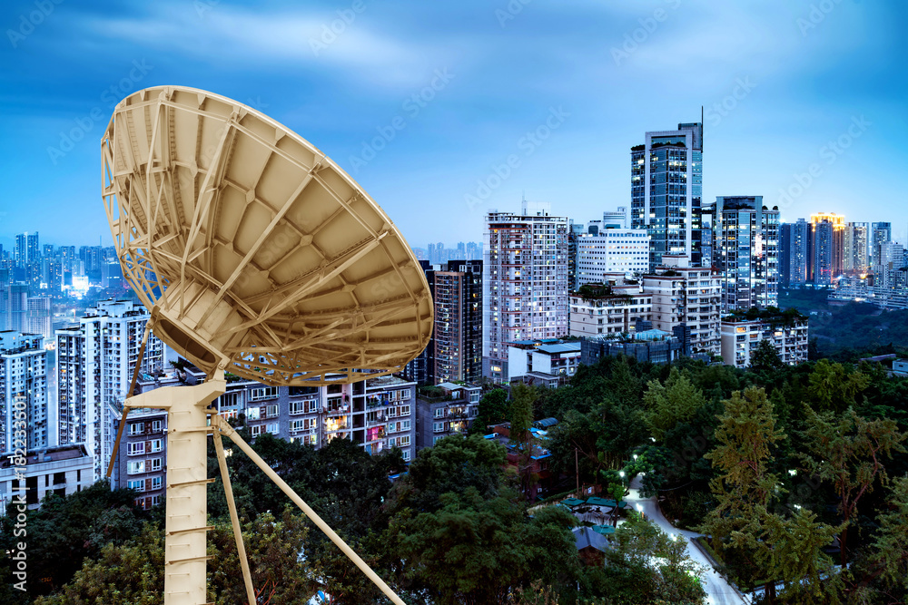 Fototapeta premium City night view and satellite dish
