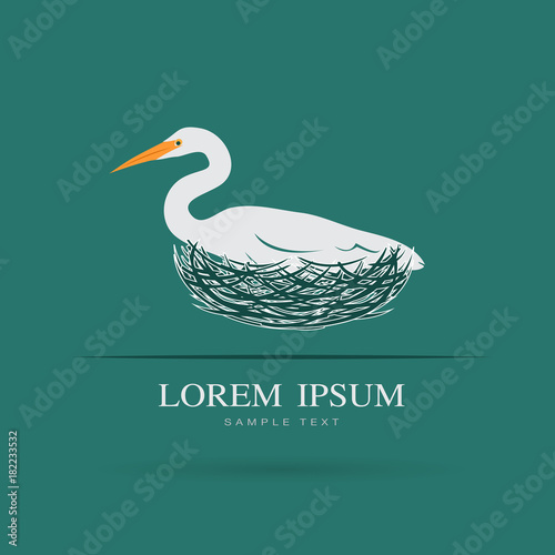 Vector of Egret bird is feeding its eggs in the nest on blue background. Bird Logo. Animal.