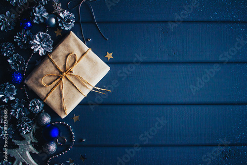 blue christmas background with gift and cones