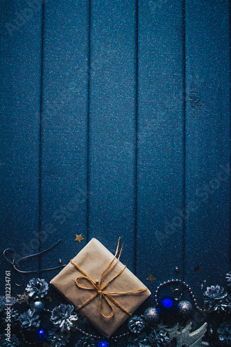 blue christmas background with gift and cones