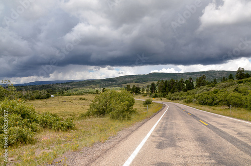 part of Utah Scenic Byway Route 12 passing Aquarius plateau and low stormy clouds over Boulder Mountain 