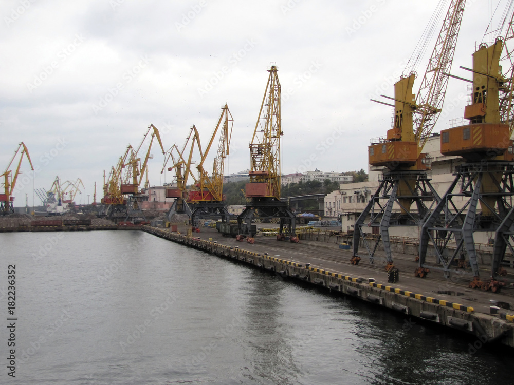 View on trading seaport with cranes, cargoes and the ship