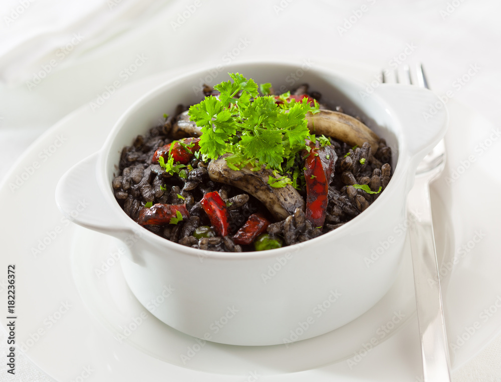 Black rice made with octopus ink and squid Stock Photo | Adobe Stock