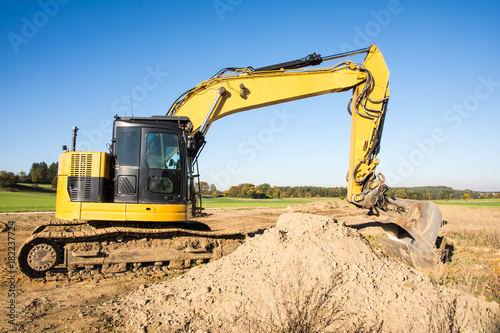 Yellow earth mover at a construction site
