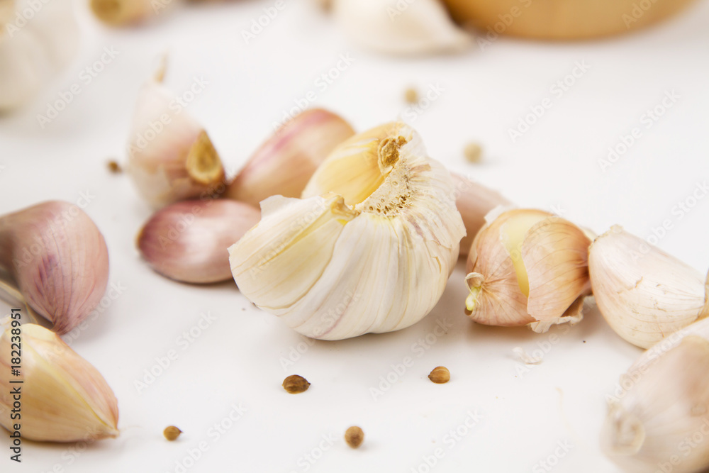 Prepare garlic for cook at white kitchen desk Prepare garlic for cook at white kitchen desk