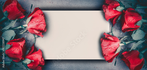 Red roses mock up banner on gray desktop background, top view.  Layout for Valentines day, dating and love greeting card, anniversary and invitations. Retro styled