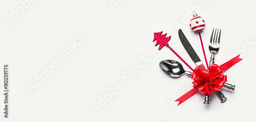 Wallpaper Mural Christmas table setting with cutlery, red ribbon and minimal decoration with copy space on white desk background, top view, banner. Layout for holiday greeting card, festive dinner invitation Torontodigital.ca