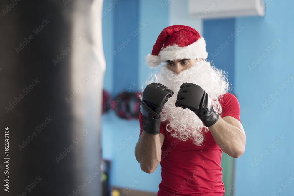 Fitness Santa claus boxing versus christmas holidays fat bag ready for  punching Stock Photo | Adobe Stock