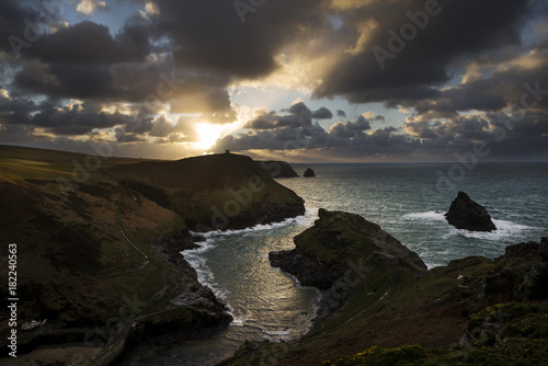 sunset with cloudy sky at boscastle , cornwall, uk