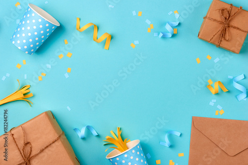 Gift box and birthday party things on a blue background