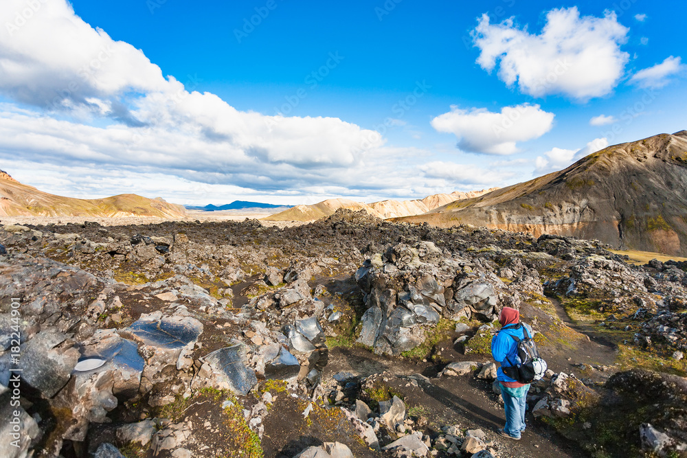 tourist at Laugahraun lava field in Iceland