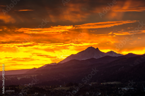 Sunset over peak Havran and Zakopane in Tatra mountains from Koscielisko, Poland