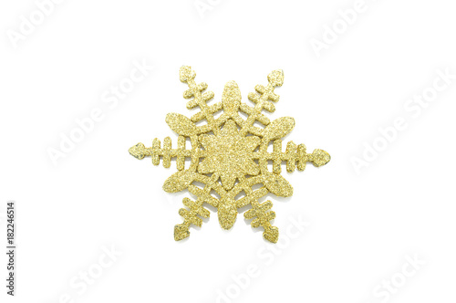 Gold snowflake on a white background close up 