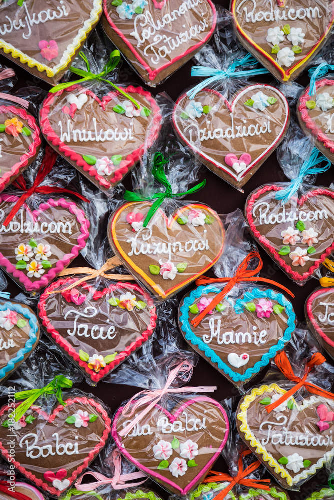 Gingerbread Hearts at Polish Christmas Market. Cracow. Xmas market in Poland. On traditional ginger bread cookies written 