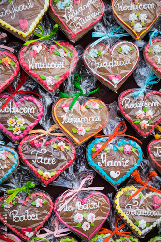 Gingerbread Hearts at Polish Christmas Market. Cracow. Xmas market in Poland. On traditional ginger bread cookies written  Dad  Mum ...  in Polish language.