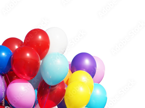Bunch of multicolored balloons under bright sunlight isolated on white background. The concept of a holiday, objects design. White, blue, yellow, red, pink inflatable balls filled with helium