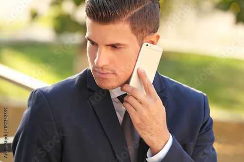Handsome businessman talkin...