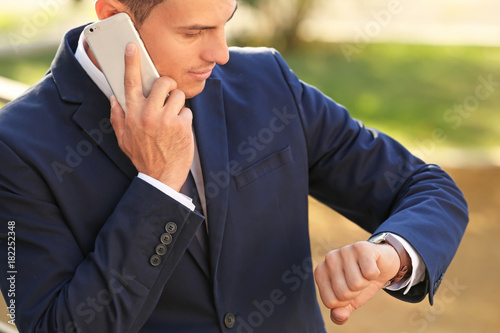 Handsome businessman talkin...