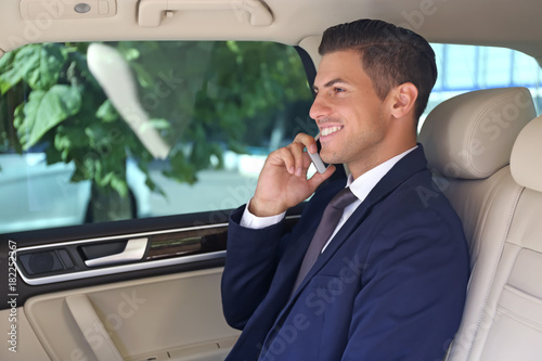 Handsome businessman talkin...
