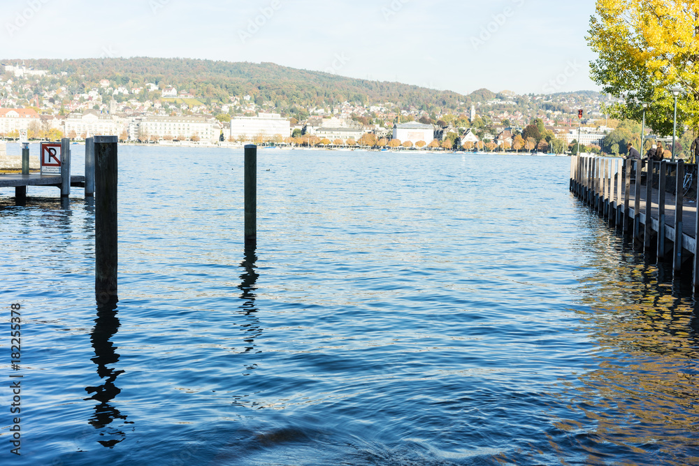 lake zurich with city buildings, boats and blue water lake zurich with city buildings, boats and blue water