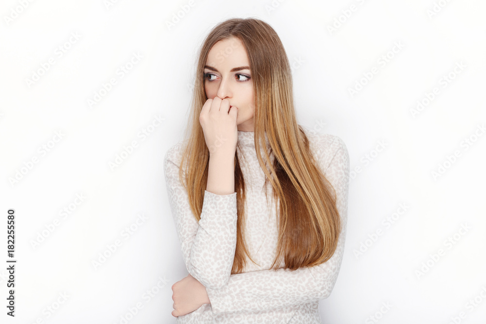 Beautiful emotional blonde female model looking pensive wear pajamas. Communication patterns concept. Beautiful emotional blonde female model looking pensive wear pajamas. Communication patterns concept.