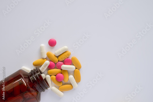 Medicine pills, vitamins and bottle on white background with copy space, Healthcare and medical concept