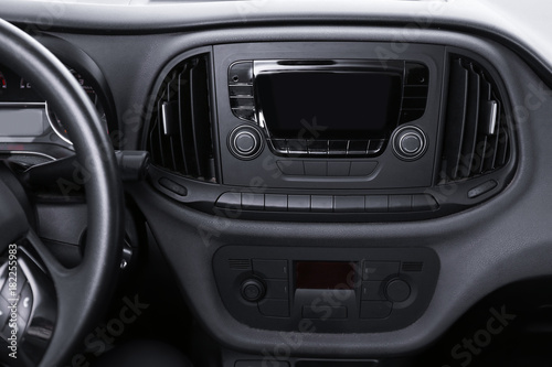 Modern radio on dashboard of car