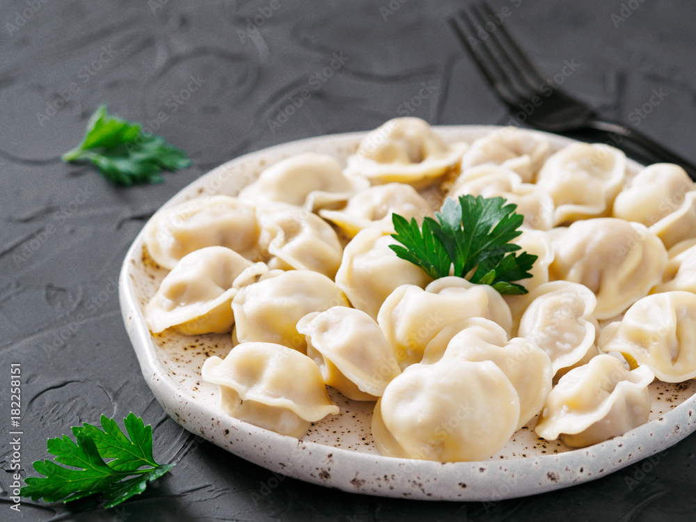 Russian pelmeni, ravioli, dumplings with meat Russian pelmeni, ravioli, dumplings with meat