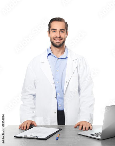 Young pharmacist with lapto...