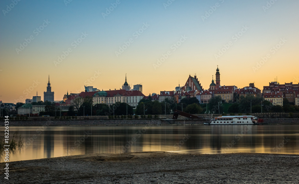Dusk over the old town and Vistula river in Warsaw, Poland Dusk over the old town and Vistula river in Warsaw, Poland