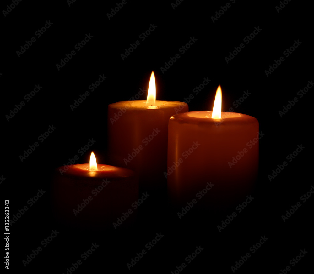 Burning candles on dark background Burning candles on dark background