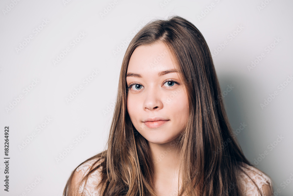 Beautiful smiling woman with clean skin, natural make-up on white background Beautiful smiling woman with clean skin, natural make-up on white background