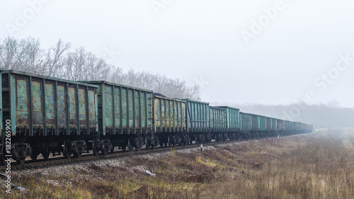 Freight train, railway wagons with motion blur effect. Transportation, railroad
