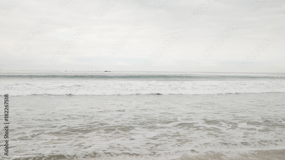 small waves on Santa Monica beach in cloudy november day small waves on Santa Monica beach in cloudy november day