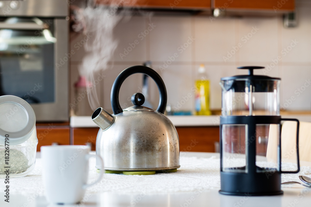 Morning yerba tea. Tasty tea brewed in cafetiere on the kitchen table.