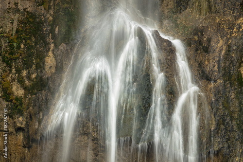 silk water flows on the stones wall in croatia