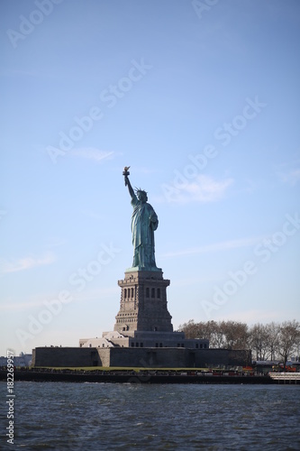 The Statue of Liberty on Ellis Island in New York City Photographed from the Hudson River © holly