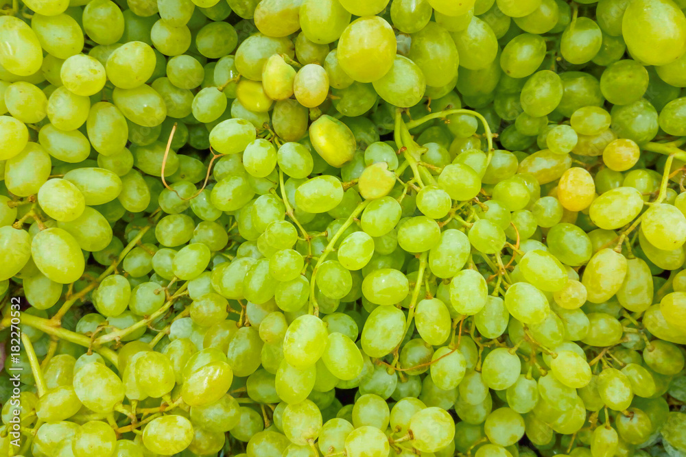 A pile of green grapes as background, texture