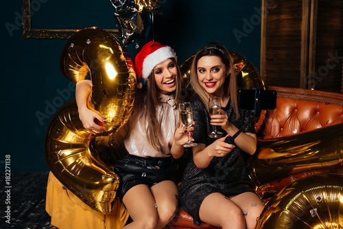 Women takes Christmas selfie on smartphone